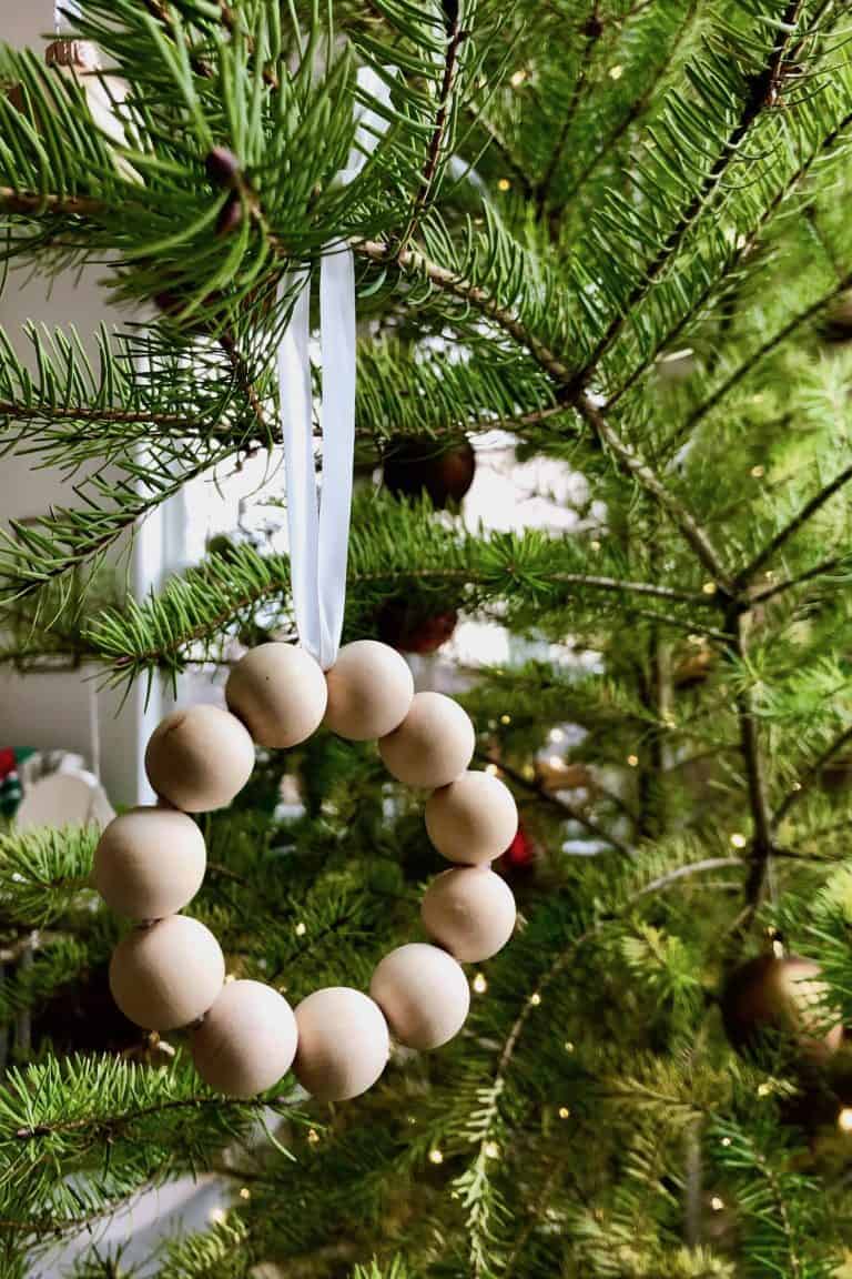 Preschoolers Christmas Ornament of Wooden Beads Hanging on the Tree