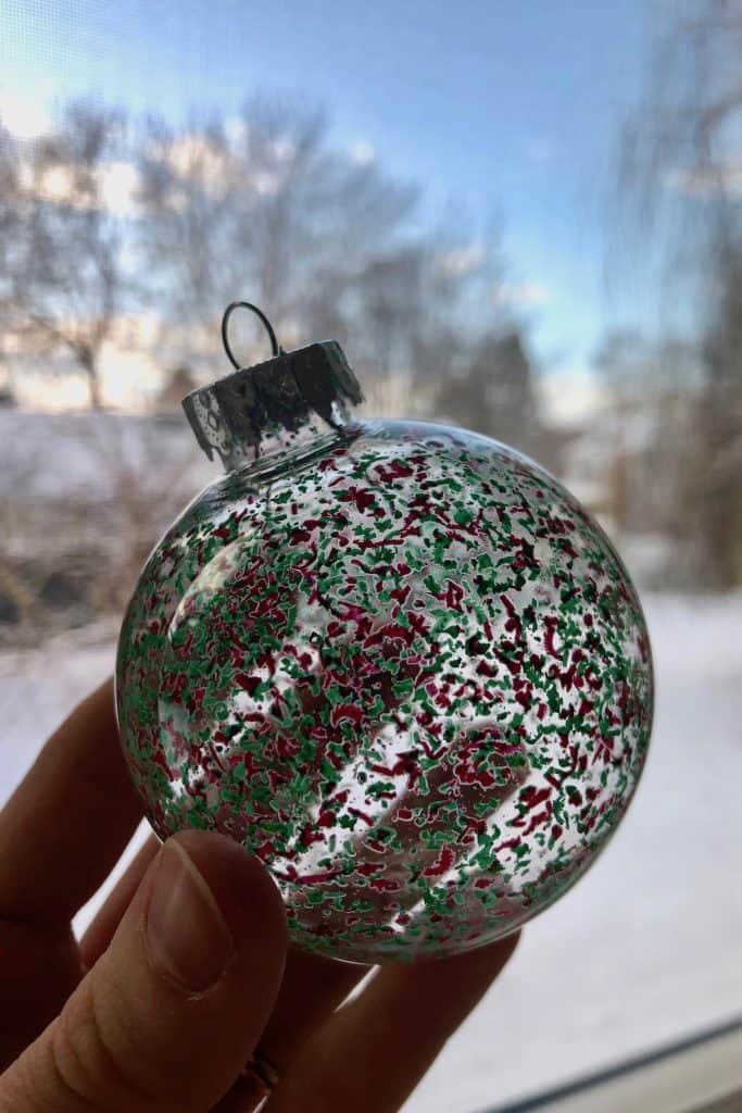 Red and green spotted tree ornament made with melted crayola crayons