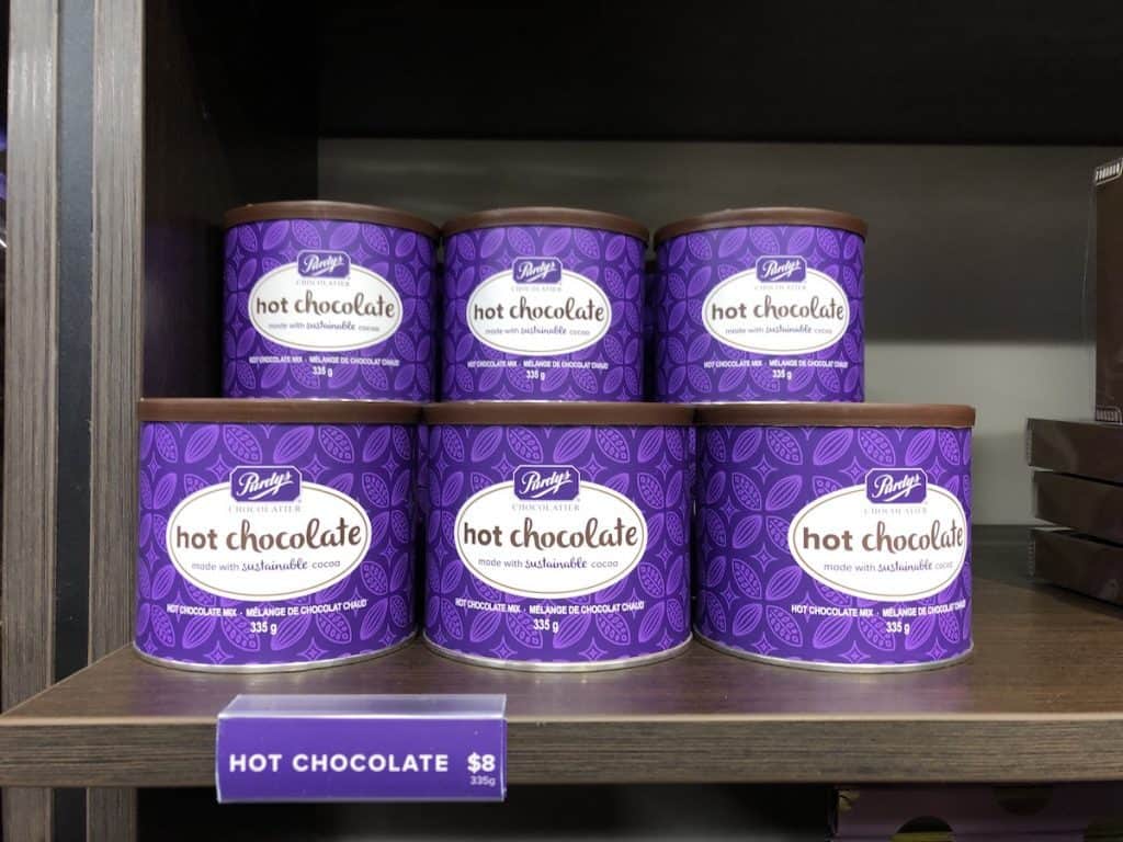Gourmet hot chocolate mix in purple canisters