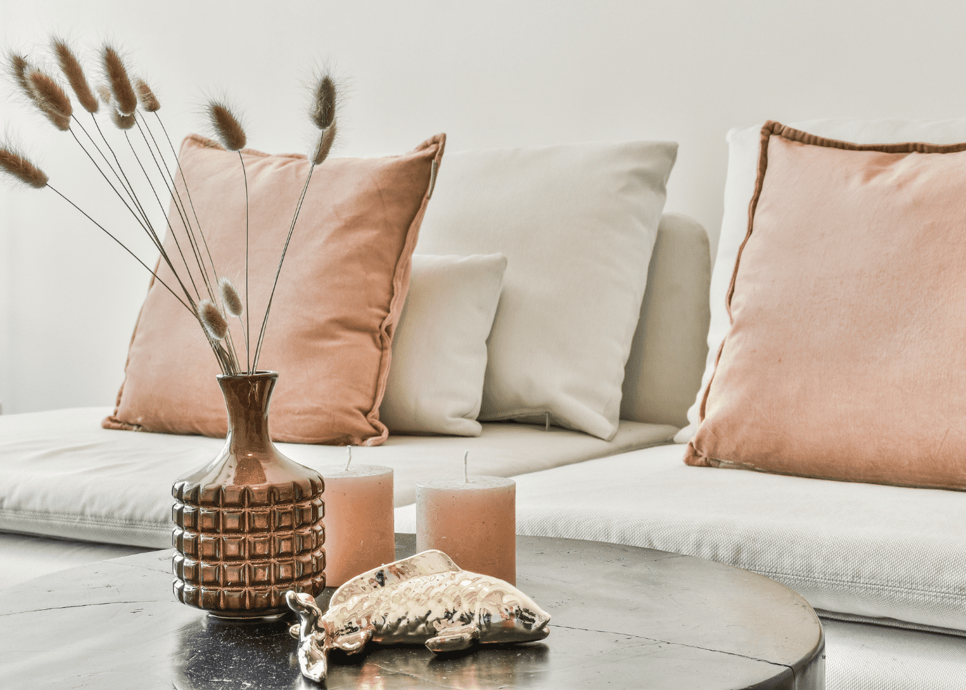 Neutral living room home decor ideas with pink and gold accents