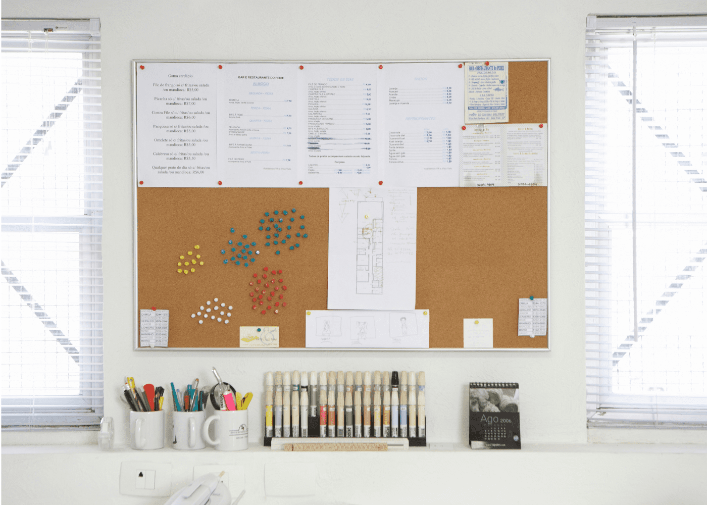 Bulletin board filled with papers for home organization.