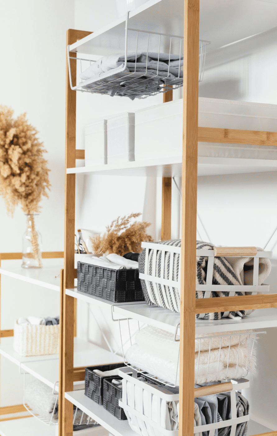 Storage bins and baskets used to organize linens and other personal items.
