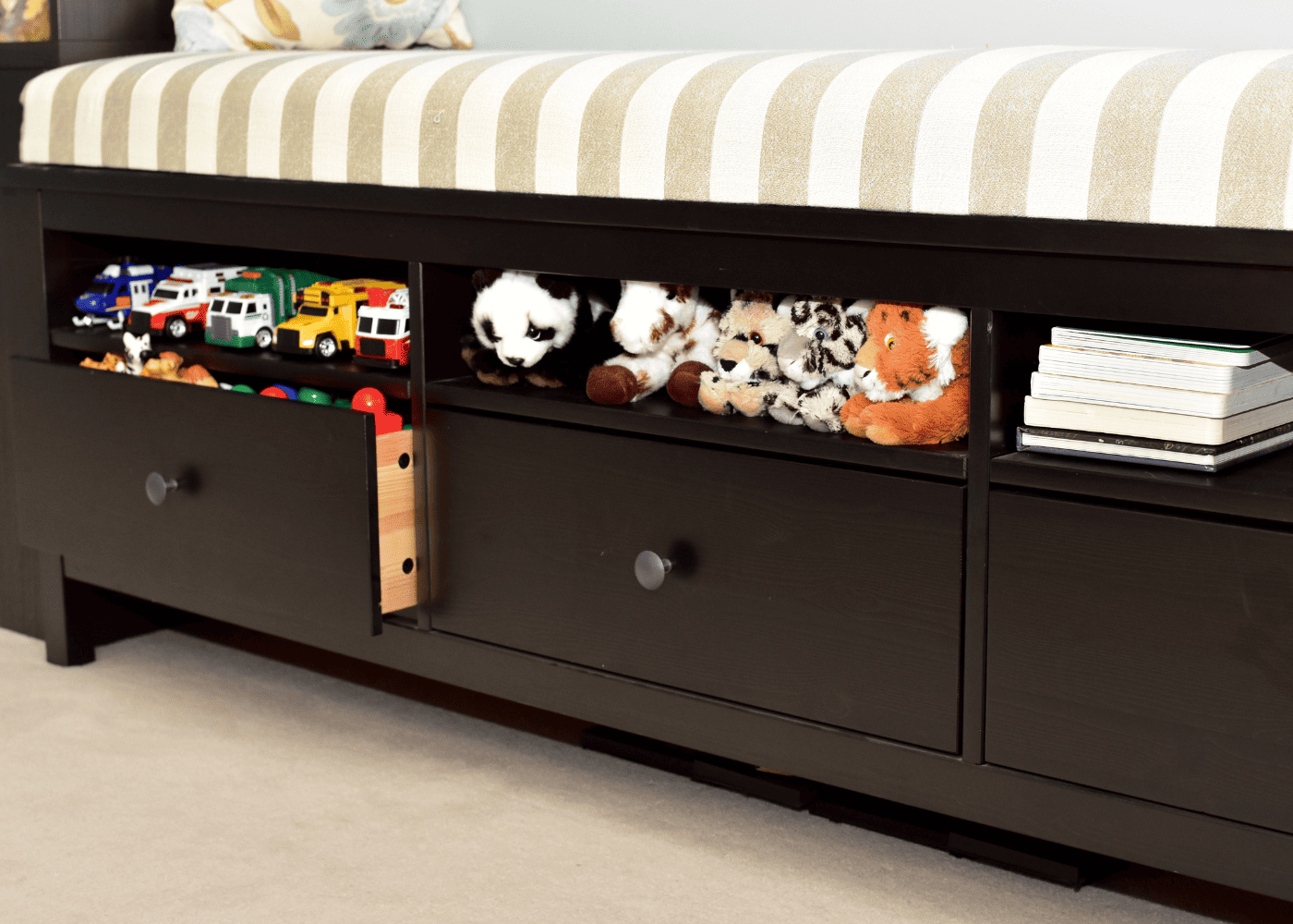 Toy car storage using the shelves on a bed.